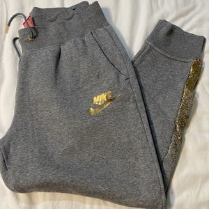Size L Nike sweatpants grey with gold accent
